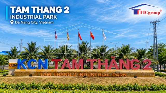 Main entrance signage of Tam Thang 2 Industrial Park in Da Nang City, Vietnam, featuring the industrial park's name, flags, and landscaped surroundings